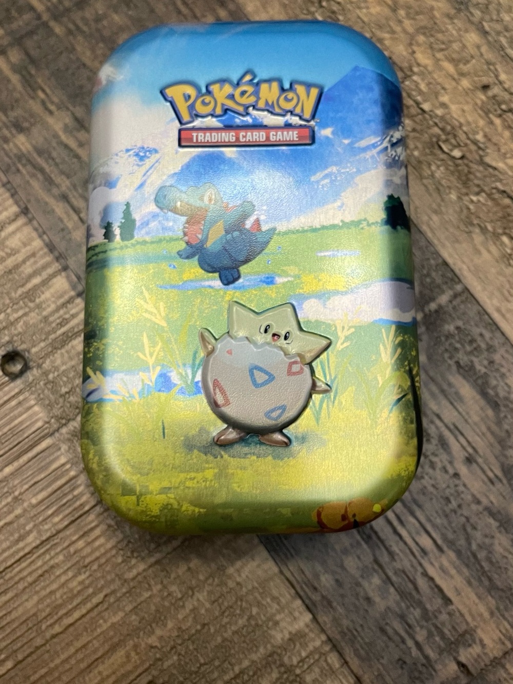 Pokémon TCG:metal tin featuring Togepi-listing for 1 tin and sticker
